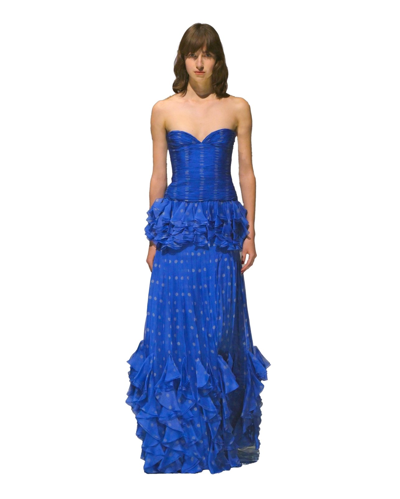 Valentino on model wearing a strapless long blue dress with ruffles and polka dots