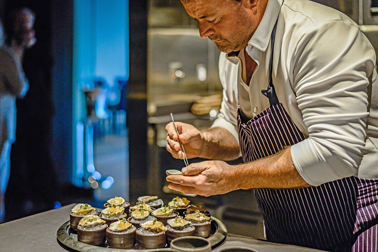 Chef Douglas Keane plates Kushi oysters in the kitchen of the Michelin-starred Cyrus Restaurant in Sonoma County