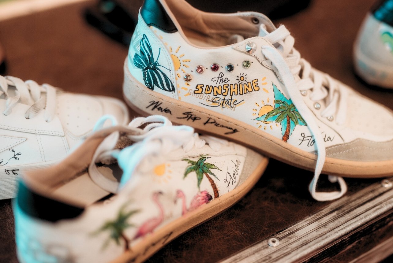 White sneakers that read The Sunshine State with fun tropical illustrations