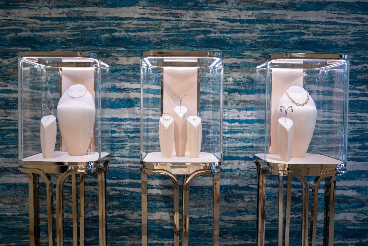 Three Tiffany display cases showcasing jewelry at Bal Harbour Shops