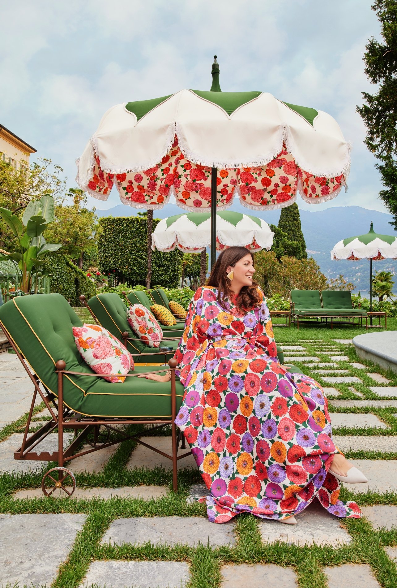 Passalacqua founder Valentina De Santis sitting on lounge chair in colorful dress