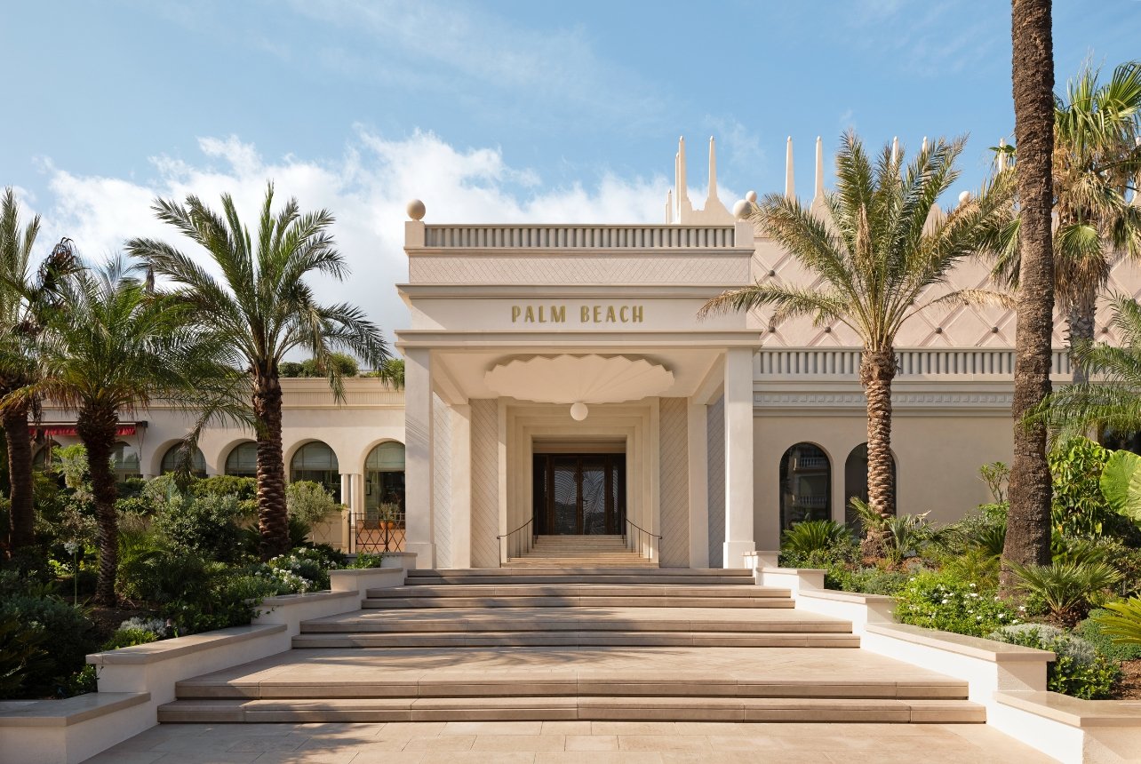 An exterior shot of the entrance of Cannes Palm Beach