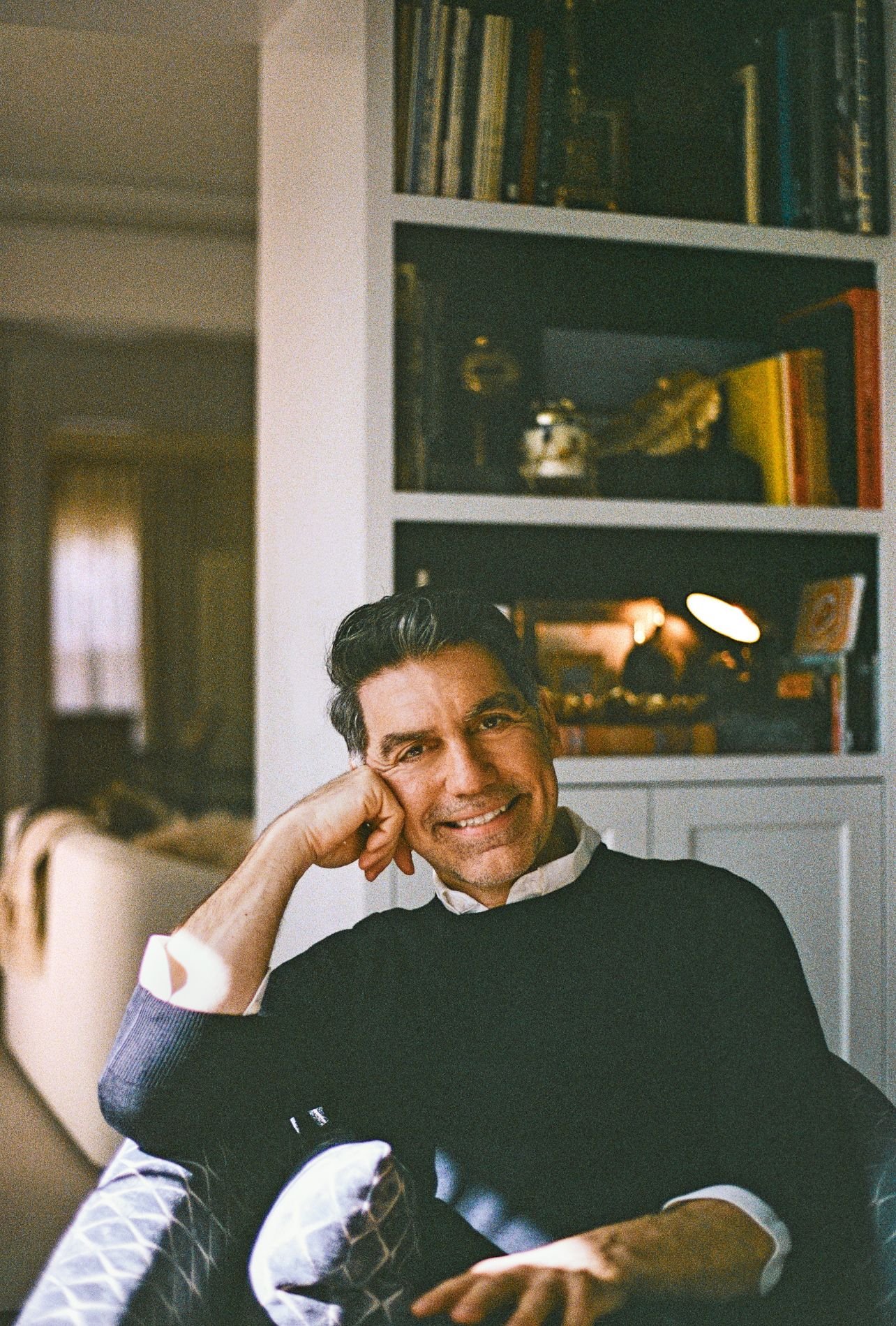 A portrait of designer Michael Aram smiling for a photo