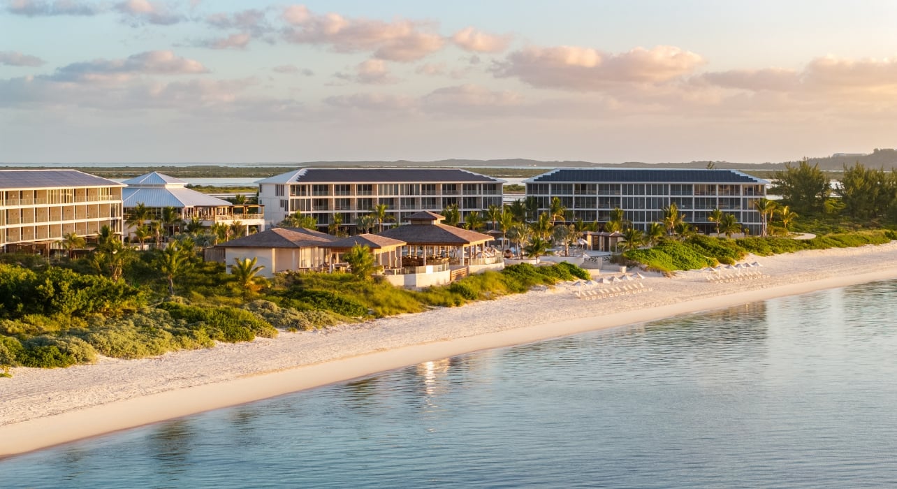 A view of a 100-room hotel with a sandy beach and oceanfront view in Salterra