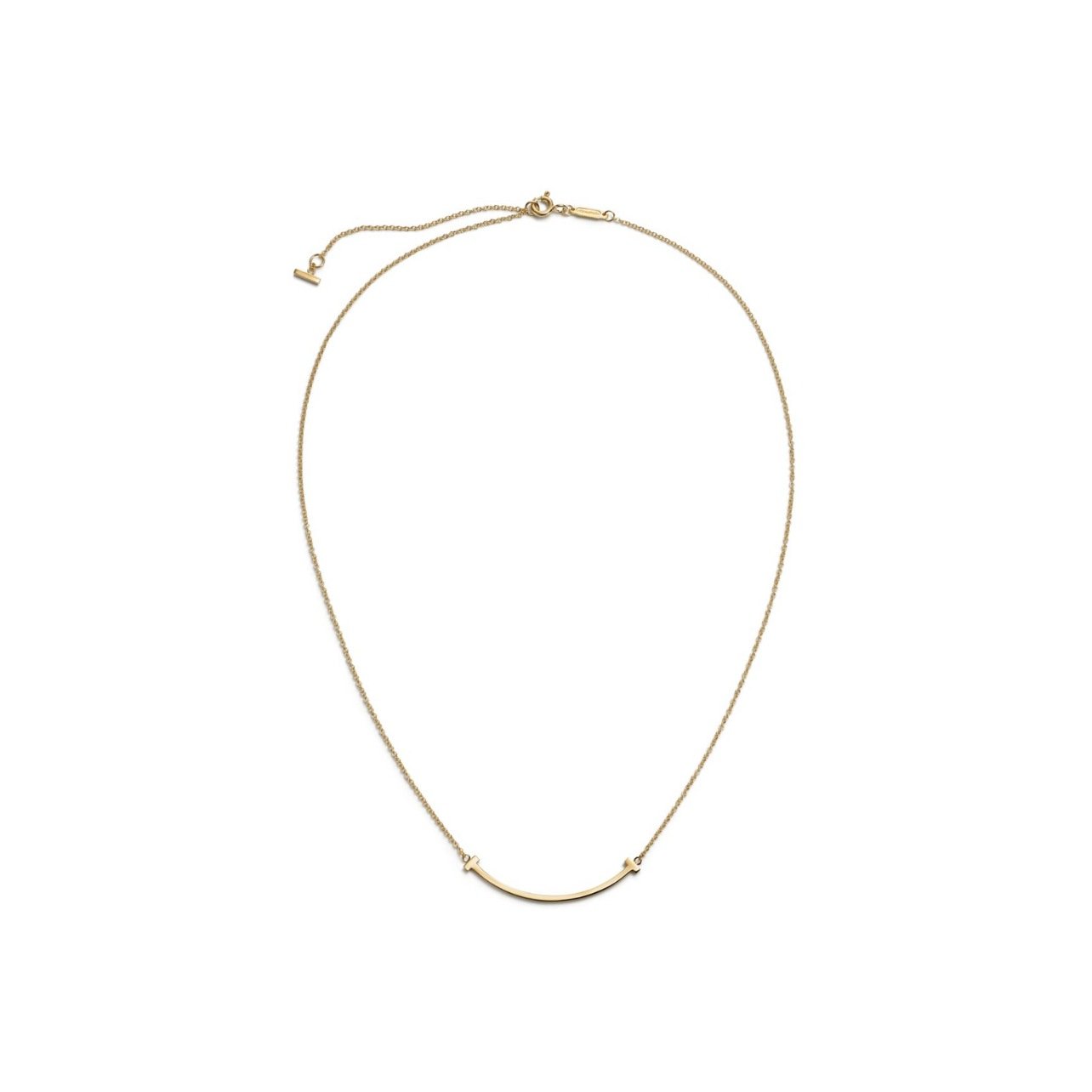 Tiffany & Co. gold necklace with a gold smile pendant