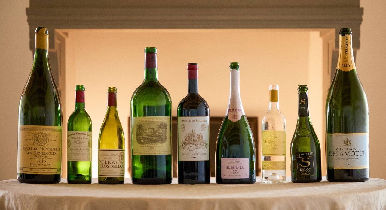 An assortment of empty wine bottles displayed on a table