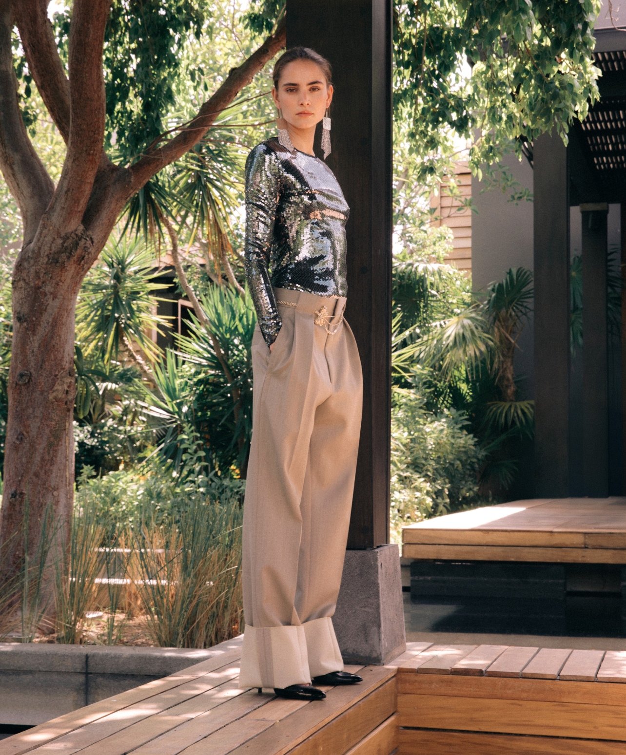 Fashion model with a sequin top and trousers