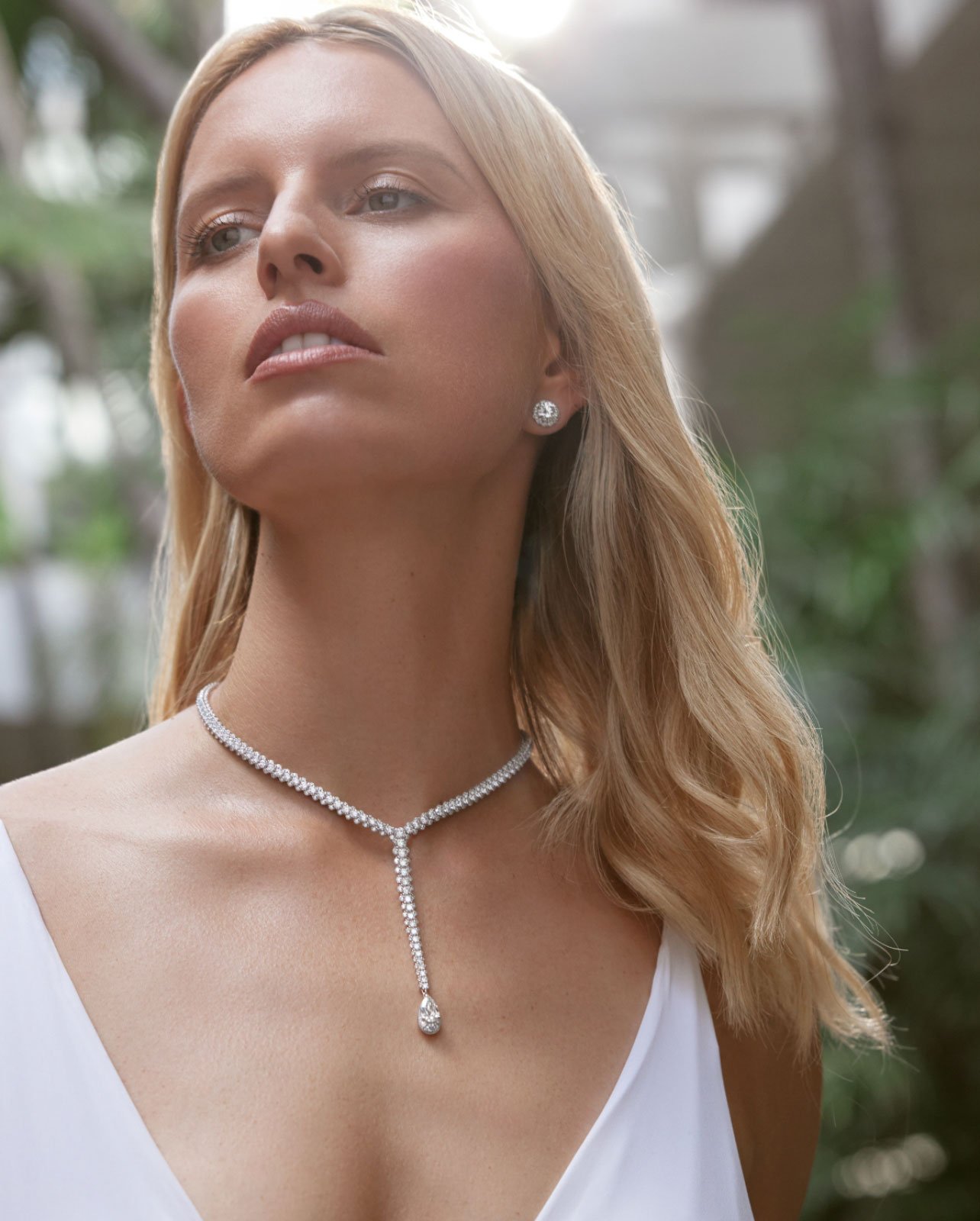 Kurkova wearing a white dress and diamond jewelry
