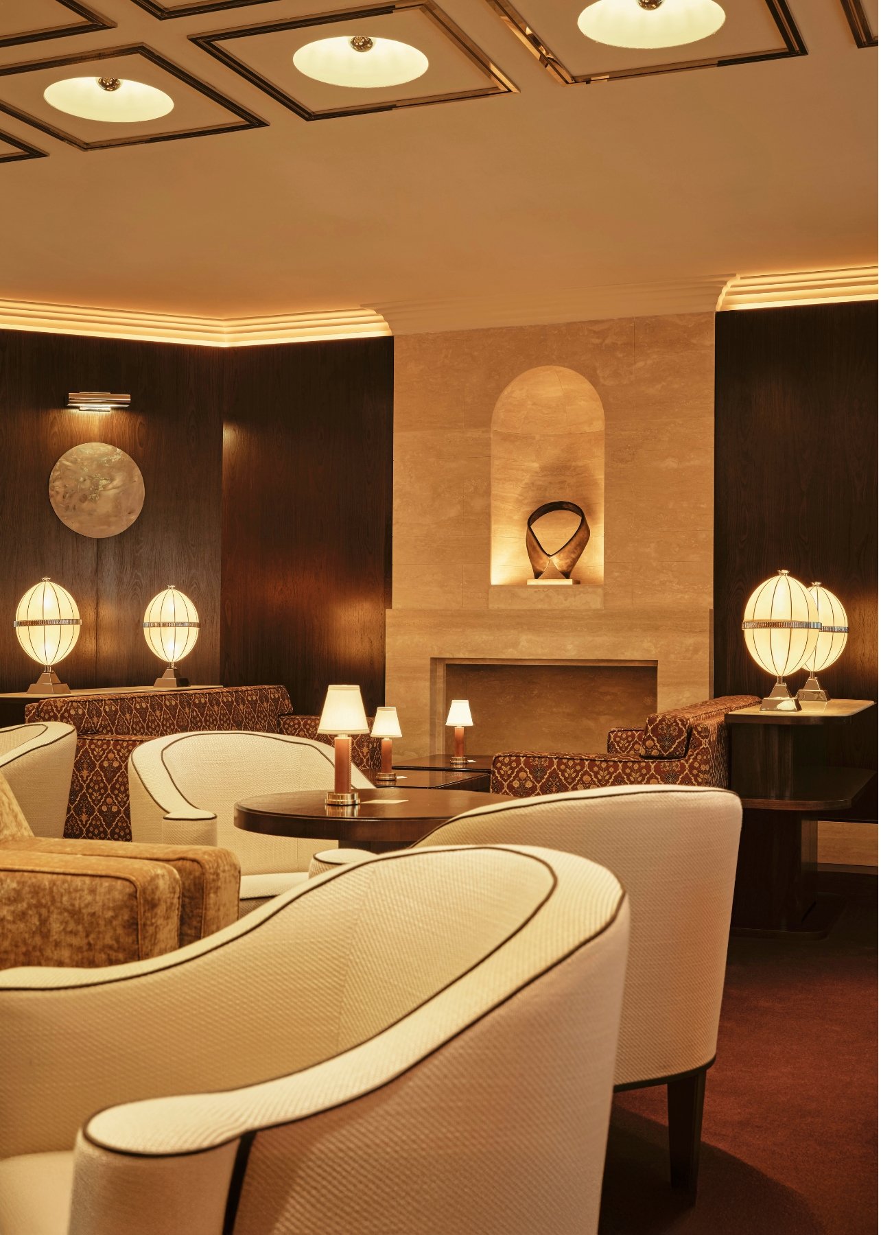 A lounge room with dim lighting and seating at The Wilde Club in Milan, Italy