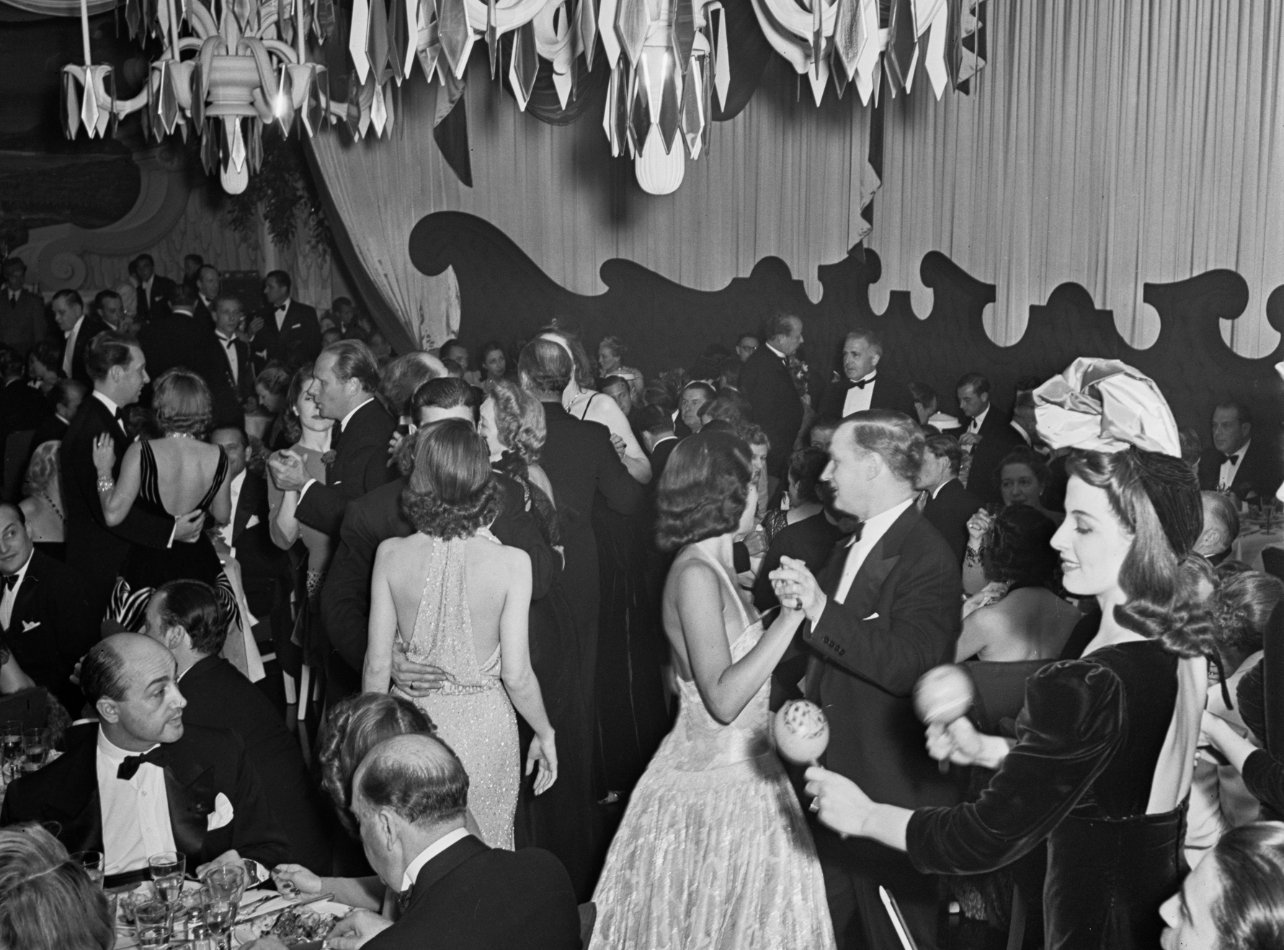 A black and white photo of people dancing and dining at Manhattan’s The Stork Club in 1946