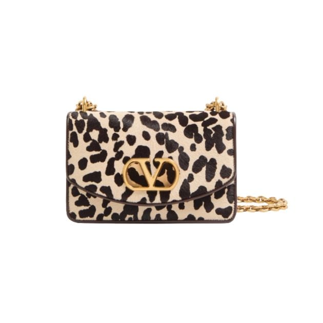 Valentino Garavani cheetah print purse with a gold logo and gold chain strap