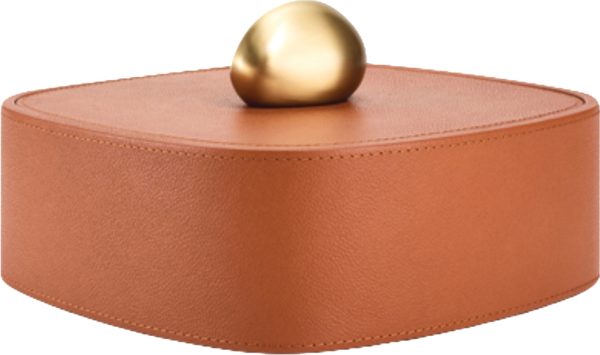 Assouline’s Pebble trinket box made of leather with an organic shaped object resembling a rock