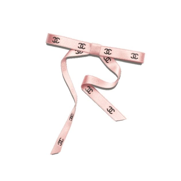 Chanel pink bow hairclip with the Chanel logo in the center