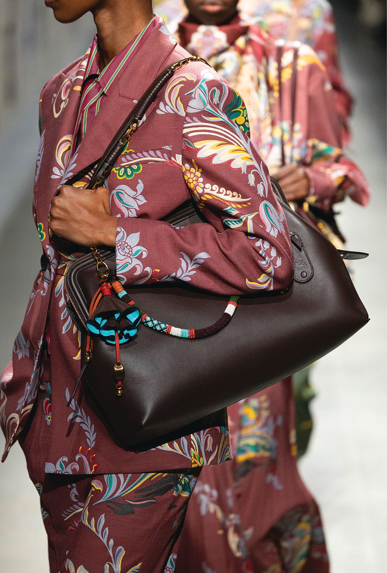 Etro runway model wearing a deep red paisley blazer and matching pant set
