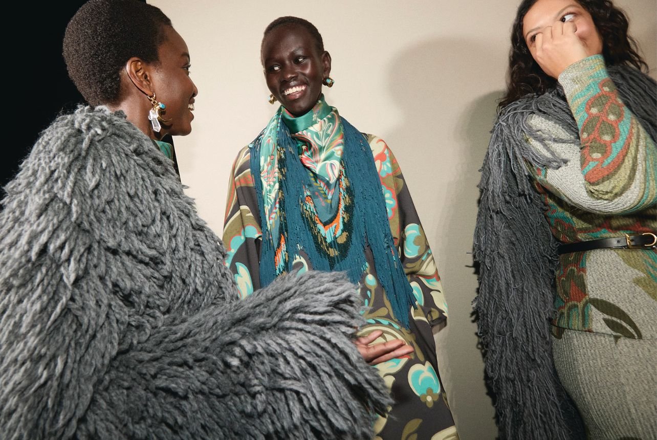 Etro runway models wearing colorful paisley tops and fringe accessories