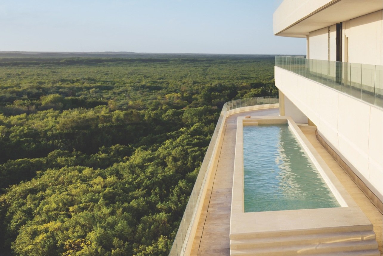 An infinity pool with a scenic view at a wellness resort