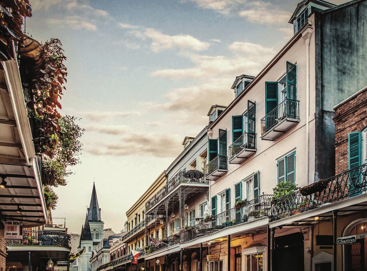 Photograph of the quaint Chartres Street in New Orleans French quarter at sunset