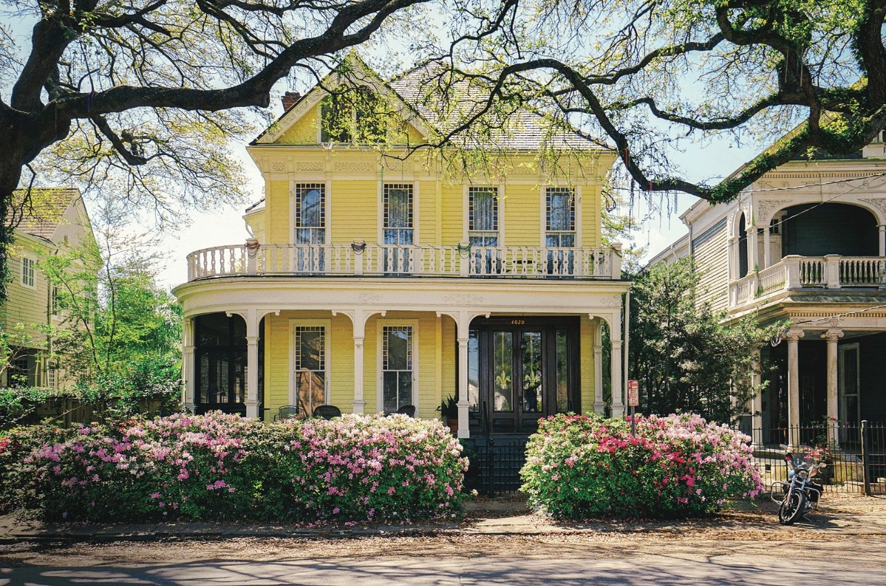 A yellow Victorian house in the Garden District of New Orleans