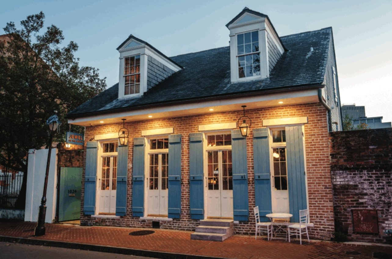 An exterior shot in the evening at the Jewel of the South bar