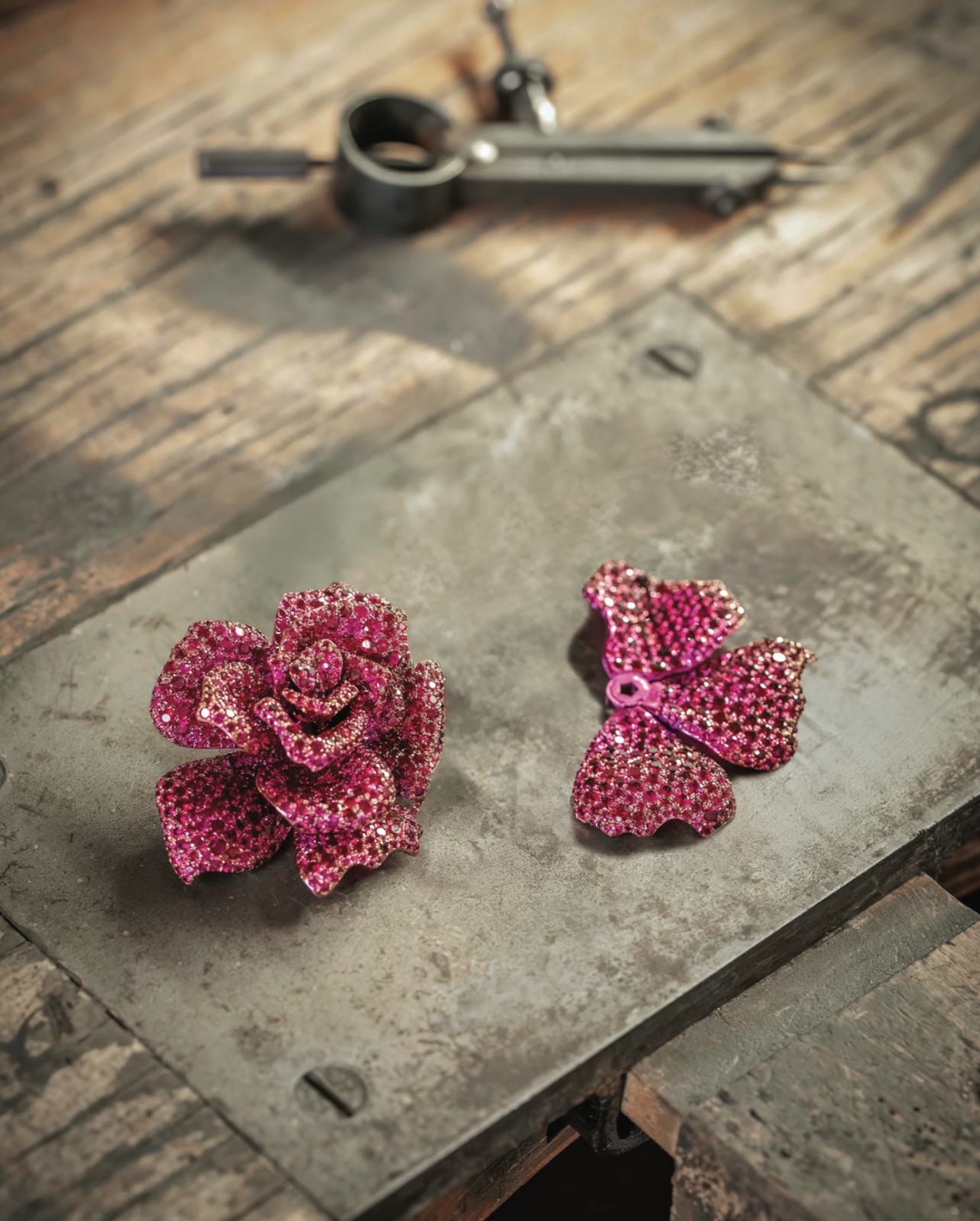 Chopard red ruby brooch being made on table