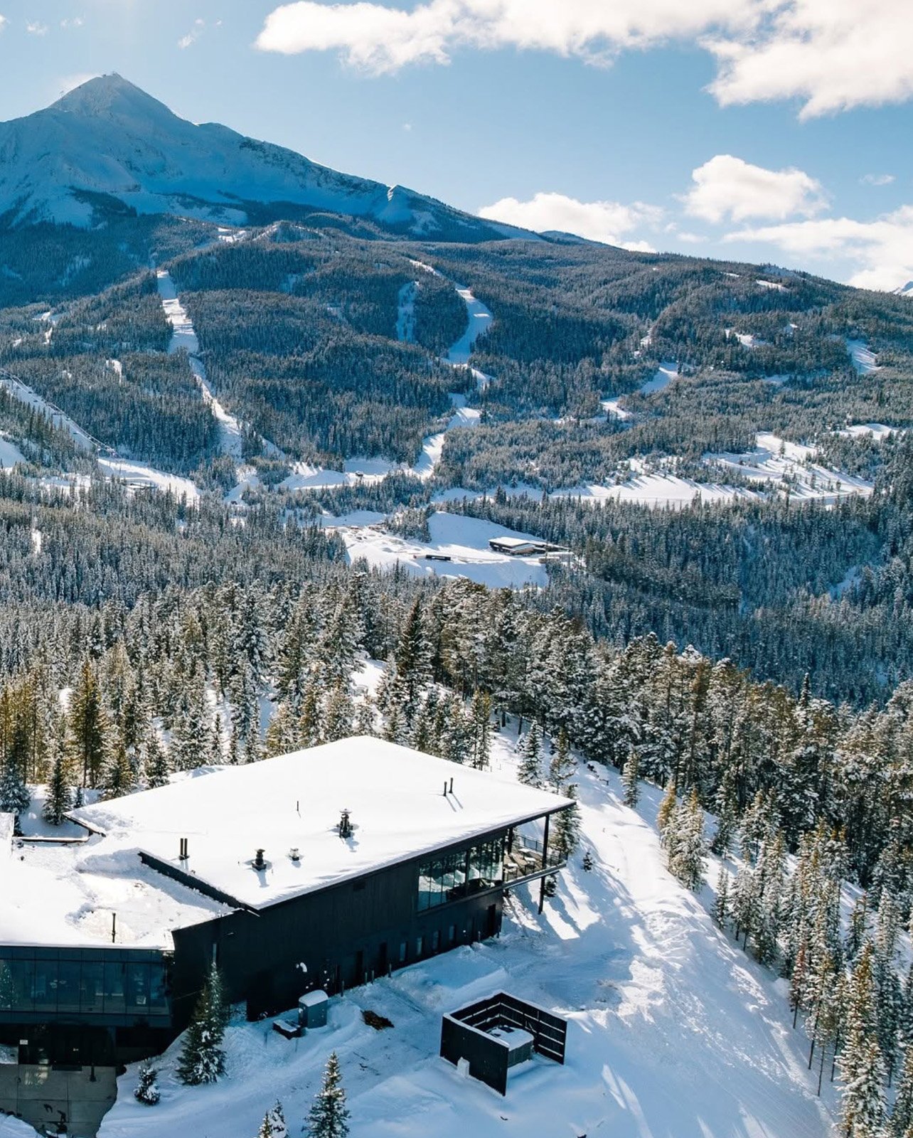 aerial view of a cabin in the snow