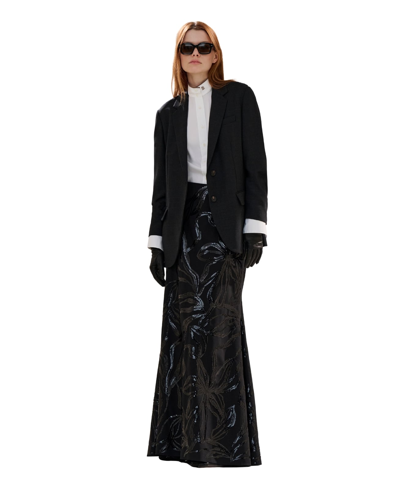 Brunello Cucinelli runway model wearing a long black skirt and blazer