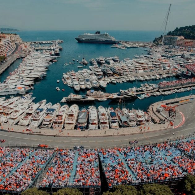 A scenic landscape of with boats with F1 stands