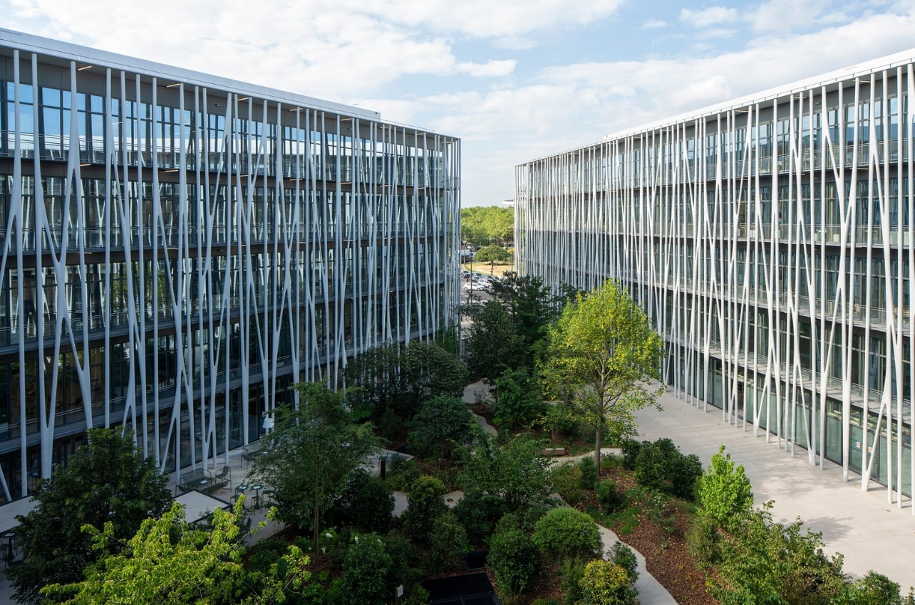 Exterior shot of buildings and a courtyard with trees