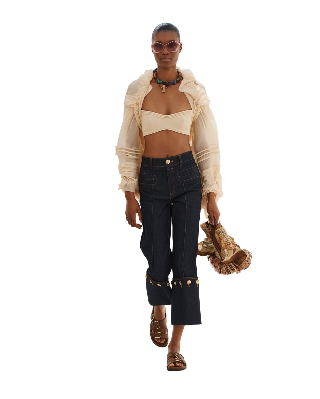 Zimmermann on model wearing a crop top and jeans