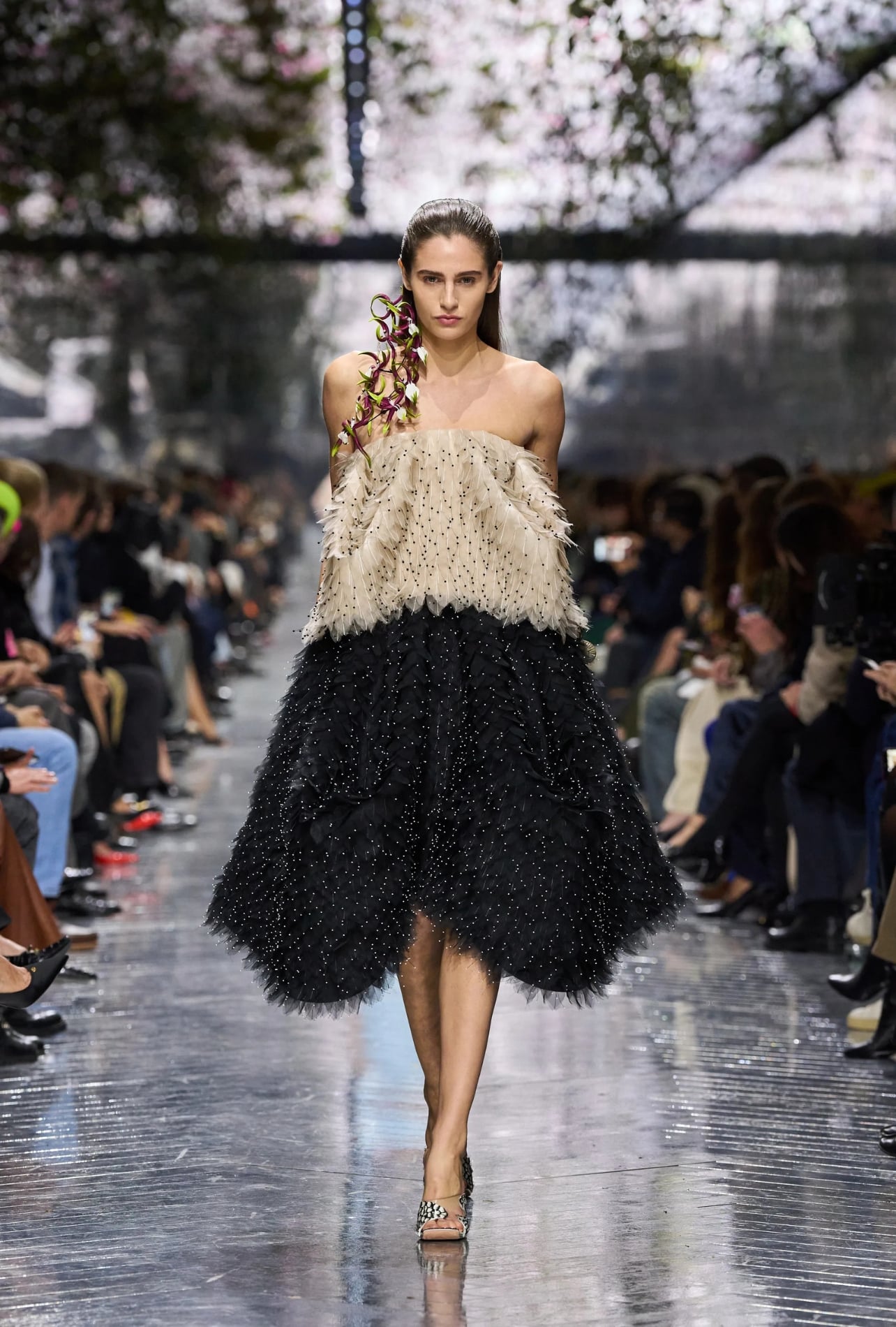 Christian Dior runway model wearing a feathered dress