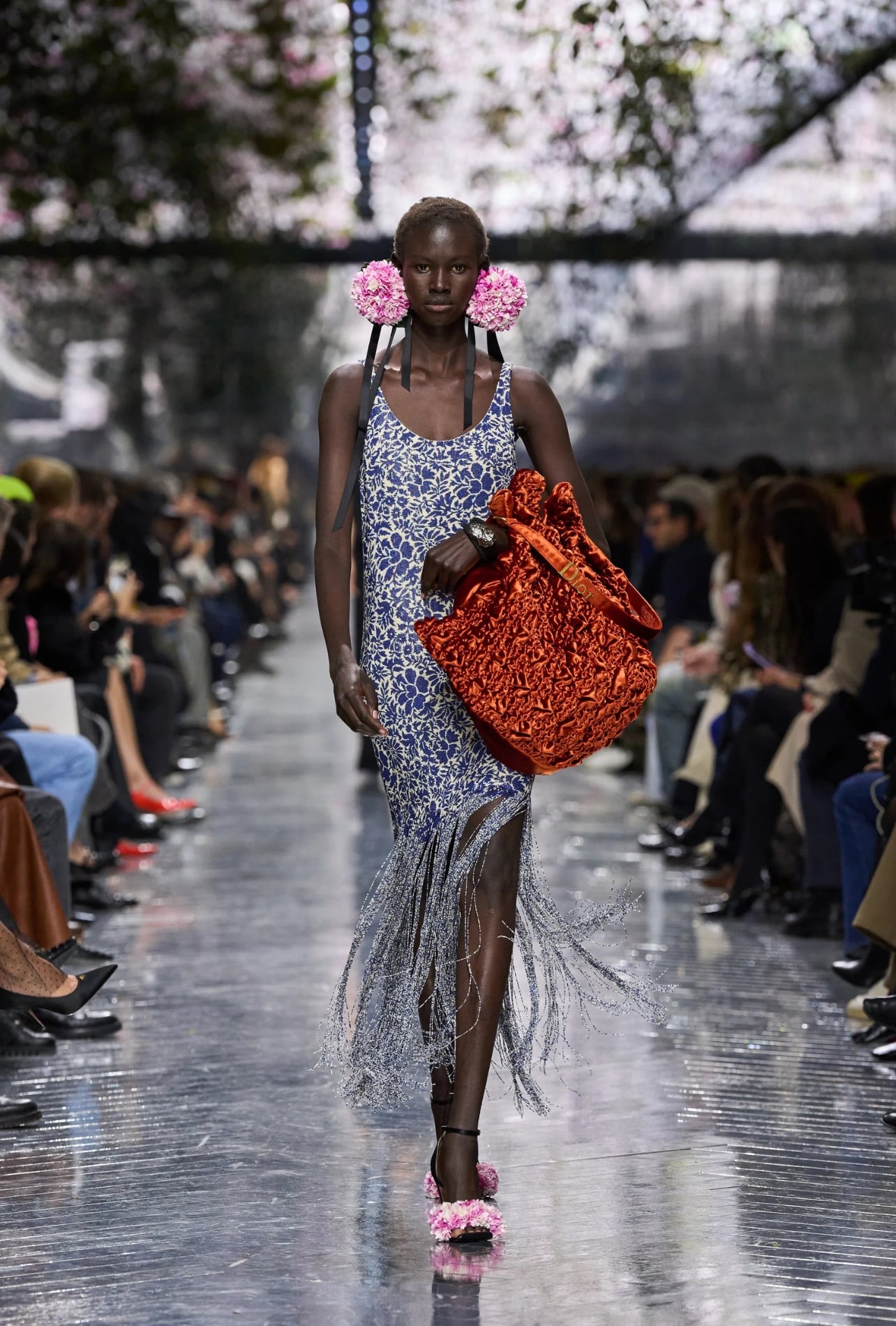 Christian Dior runway model wearing a floral dress with fringe