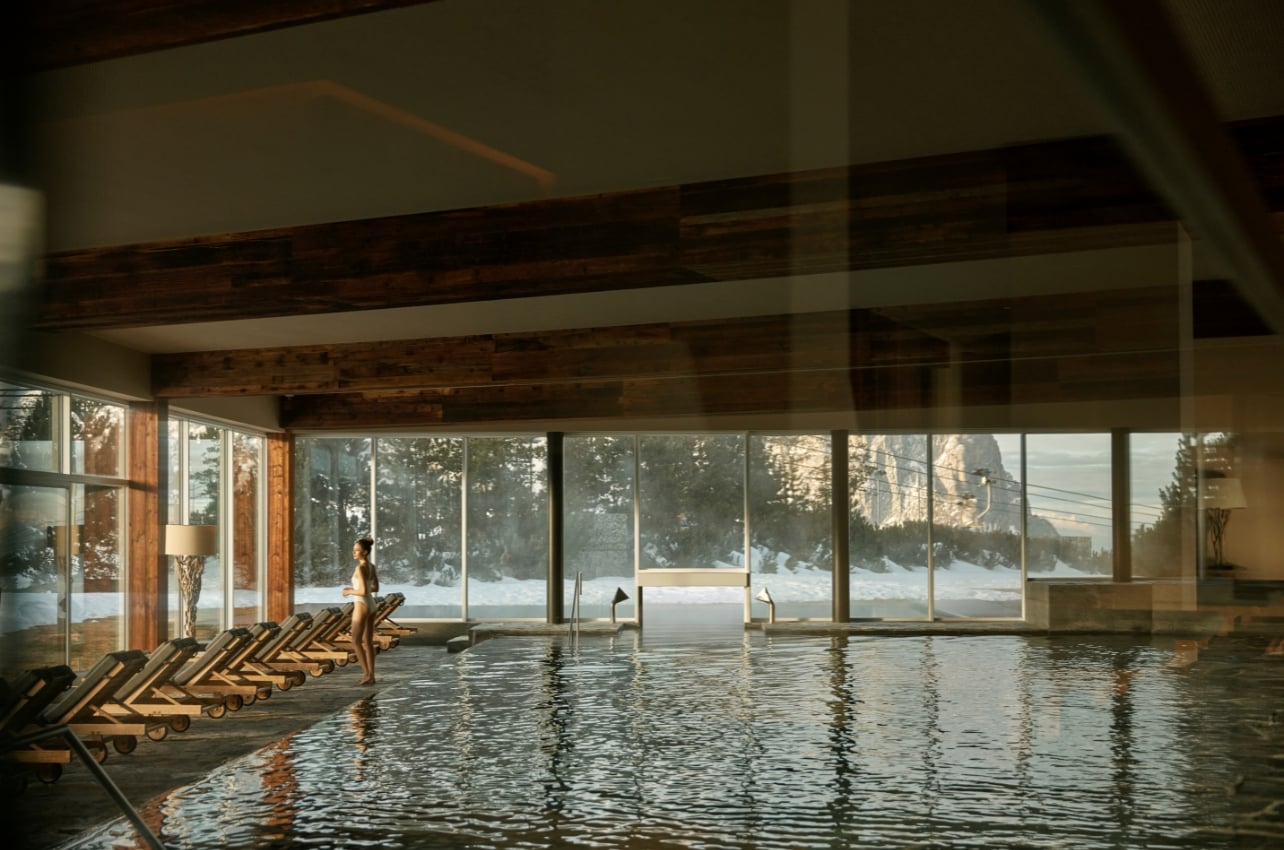 Interior shot of a hotel pool and spa with a scenic view
