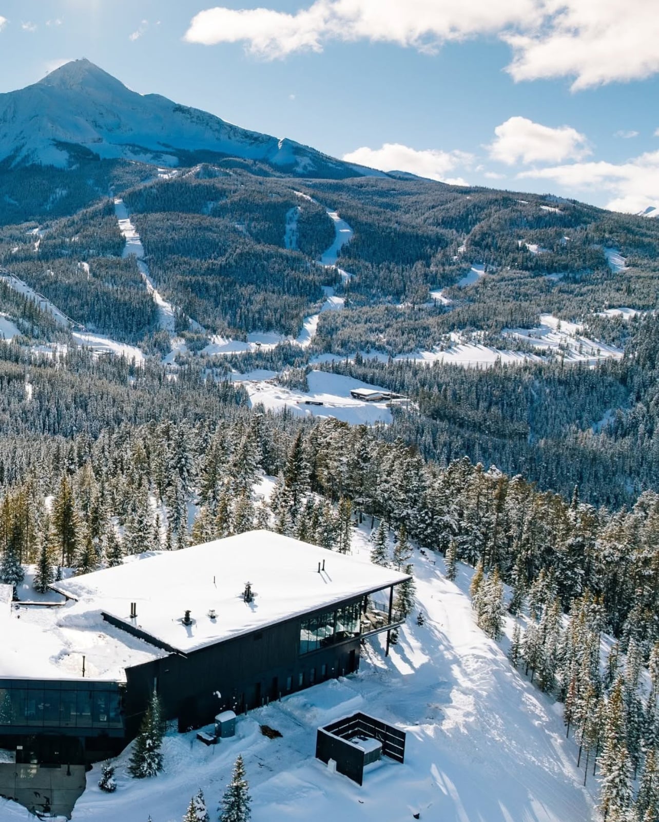 Exterior shot of a lodge placed in the mountains at One&Only Moonlight Basin