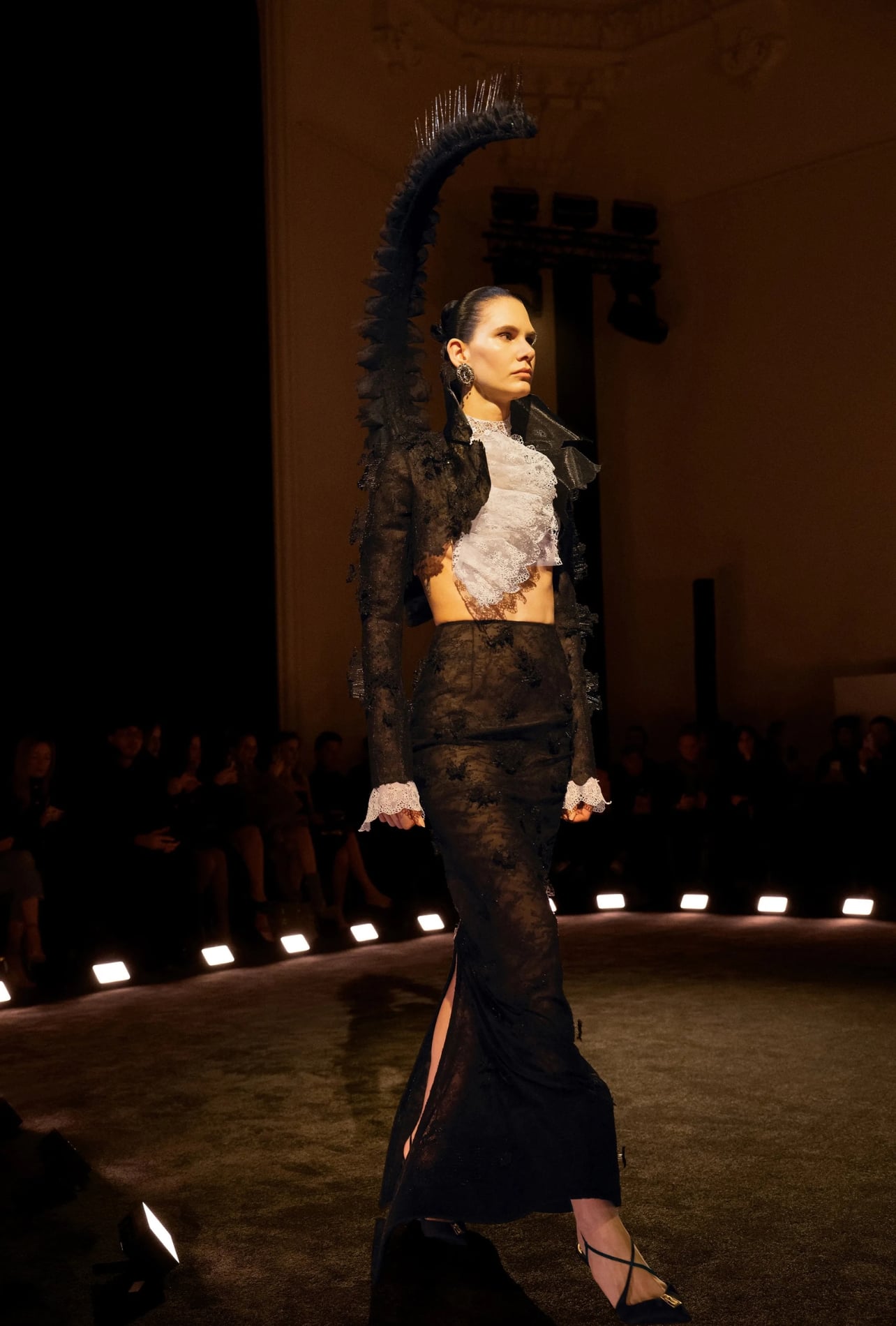 Schiaparelli runway model wearing a full lace look