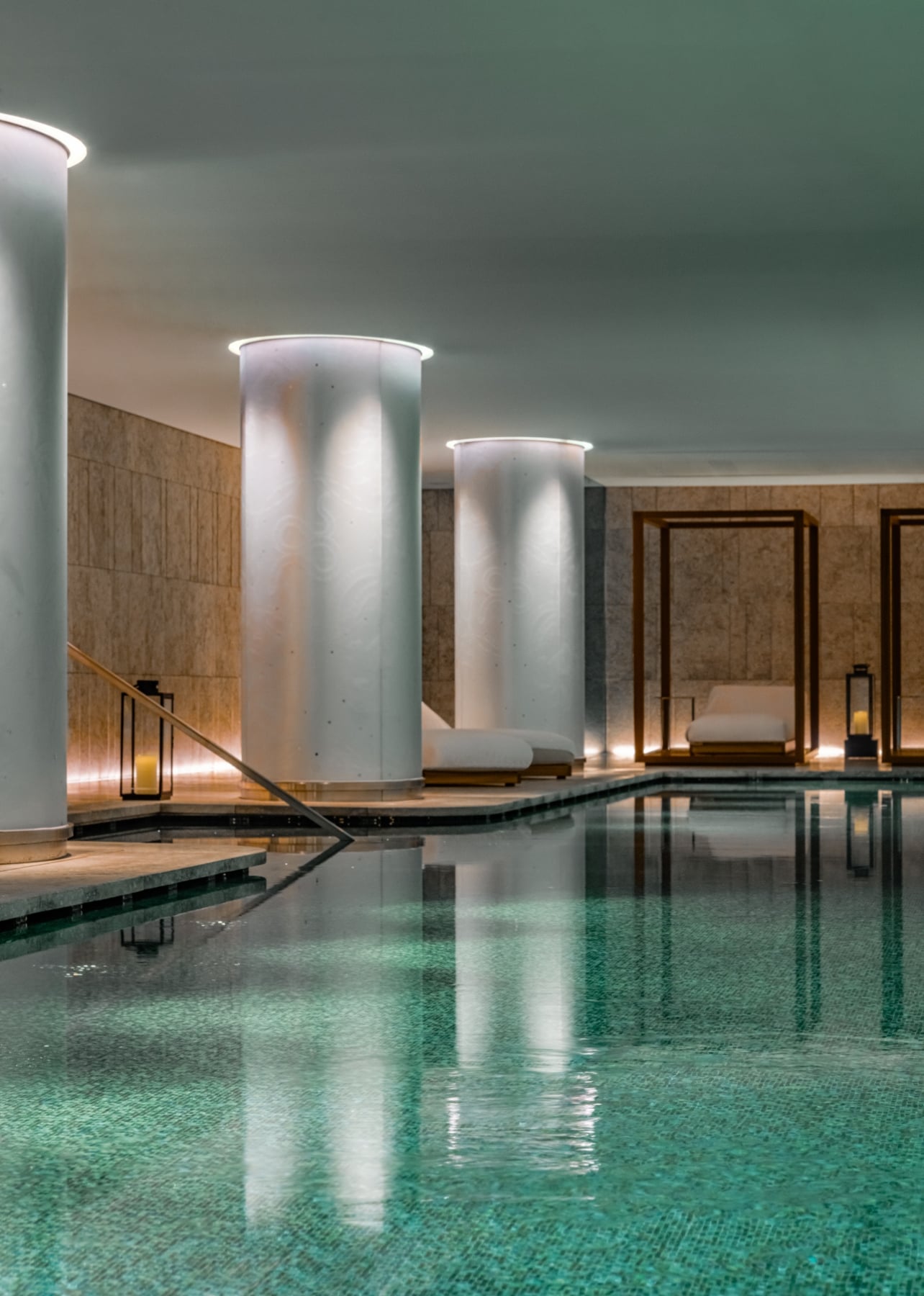 A 25-meter pool inside the spa at Bulgari Hotel Paris with daybeds