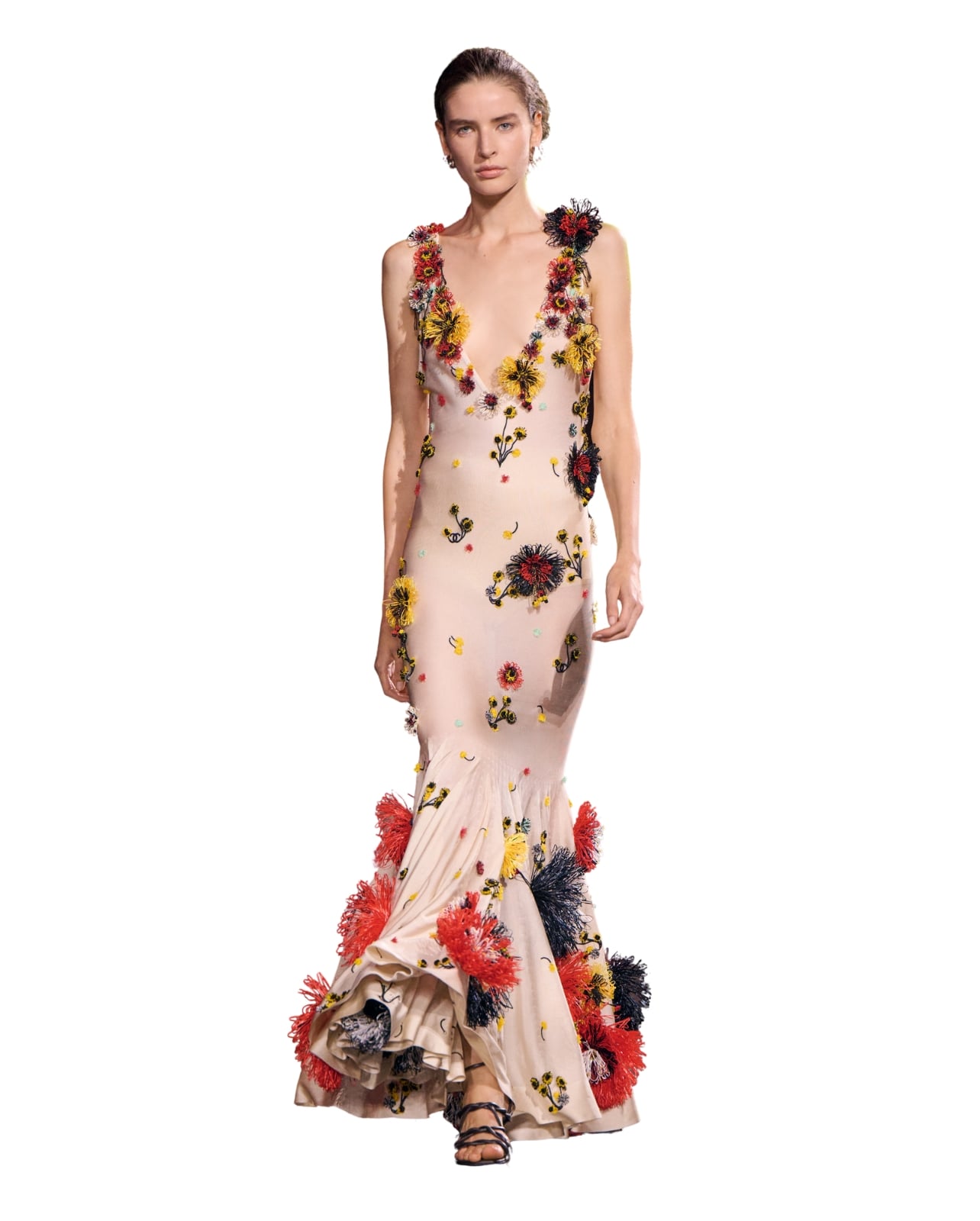 Chanel runway model wearing a long pink dress with flower embellishments