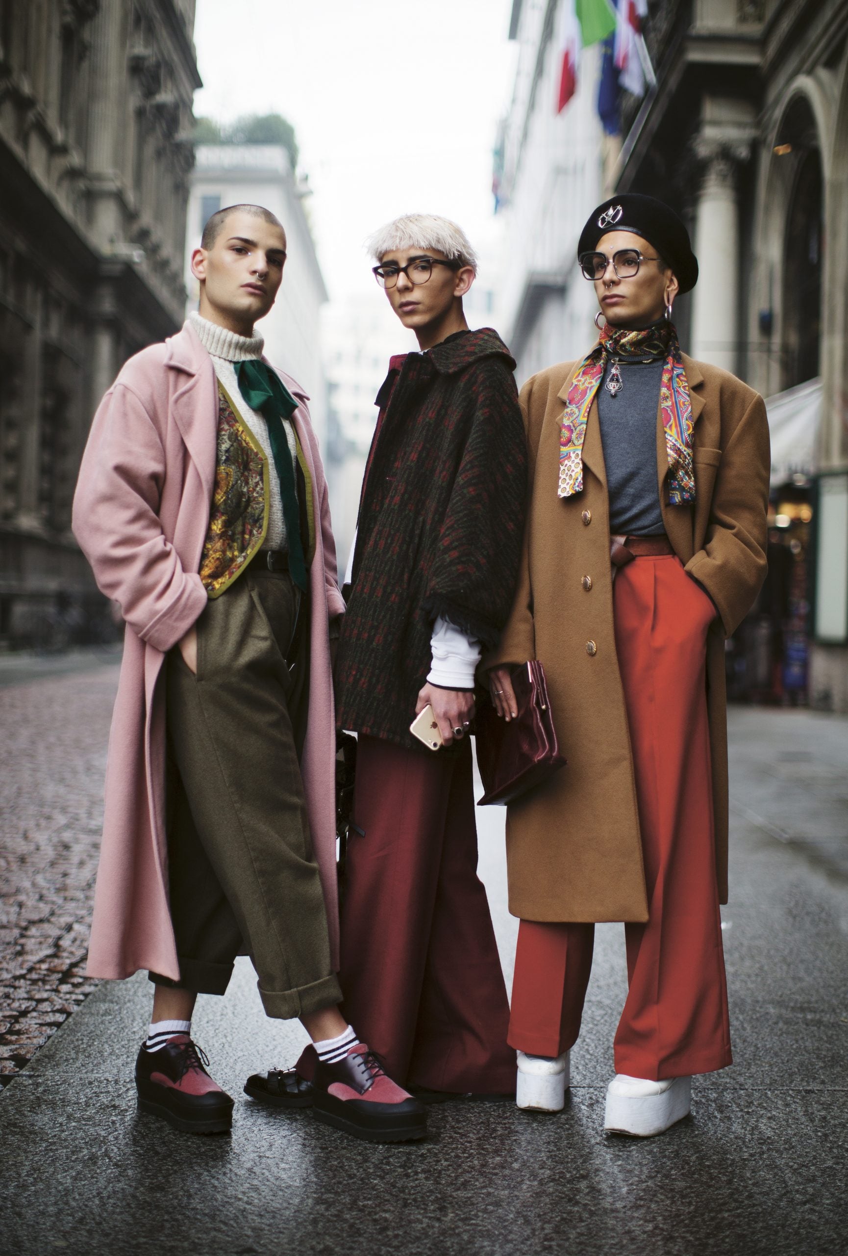 Three fashion models posing in jackets and accessories