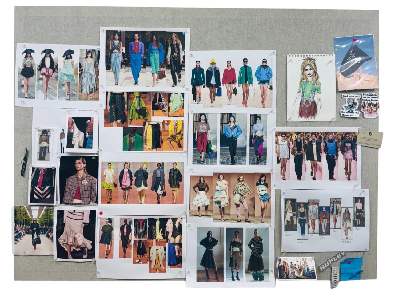 A runway moodboard of fashion models posted on a wall