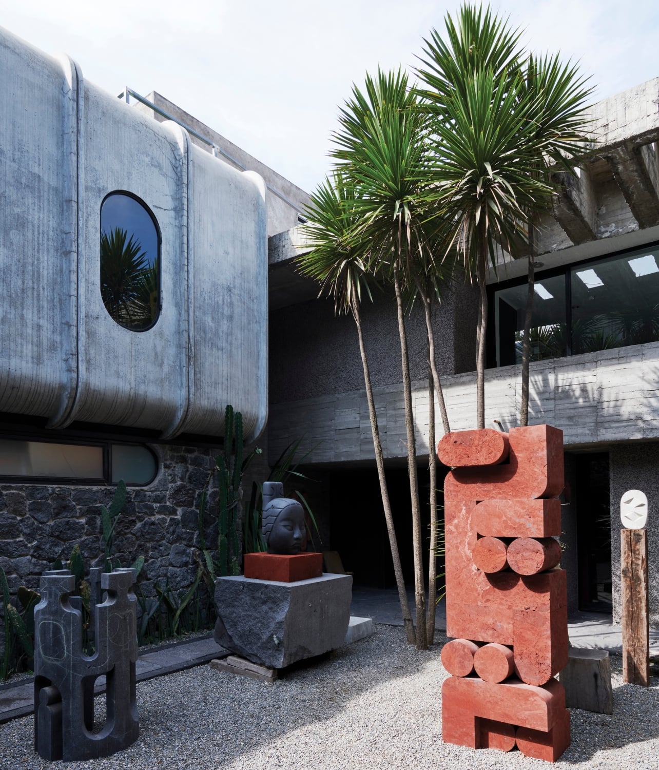 A photo of an outdoor courtyard with sculptures