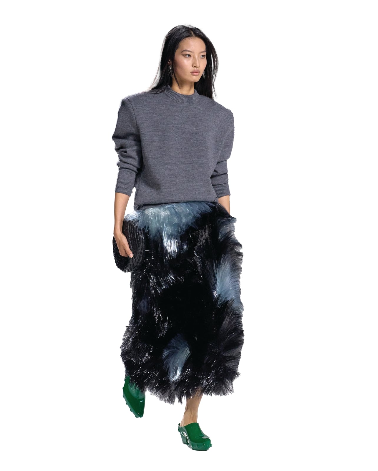Bottega Veneta runway model wearing a fur skirt and grey sweater