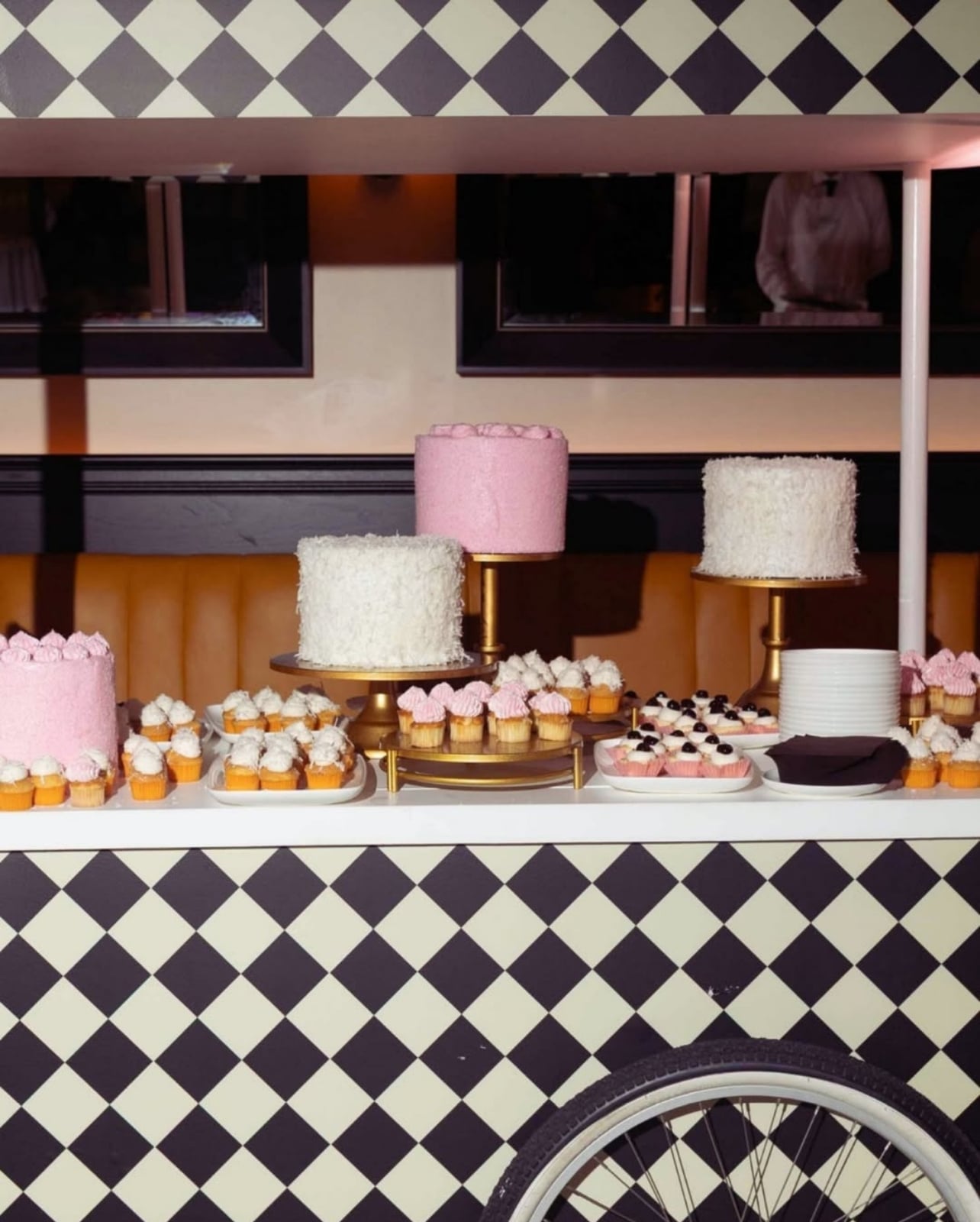 Checkered cart with desserts