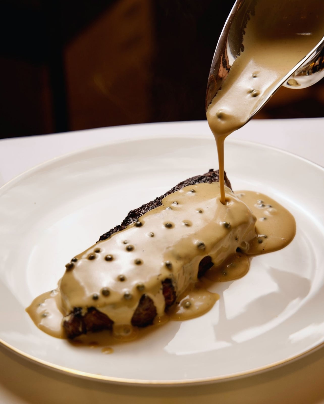 Plated Steak with sauce on top