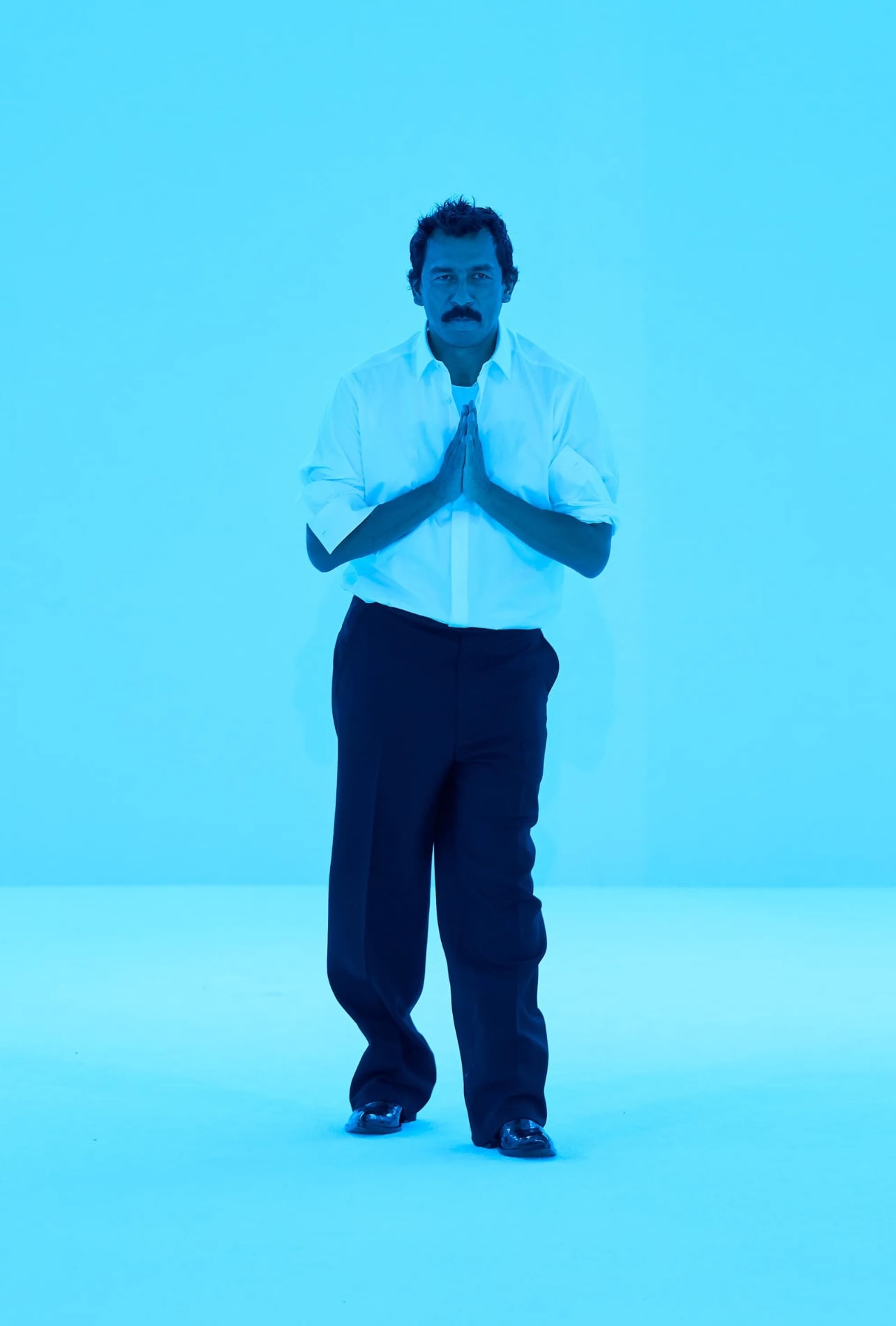 A portrait of Haider Ackermann during the Fall 2026 runway show