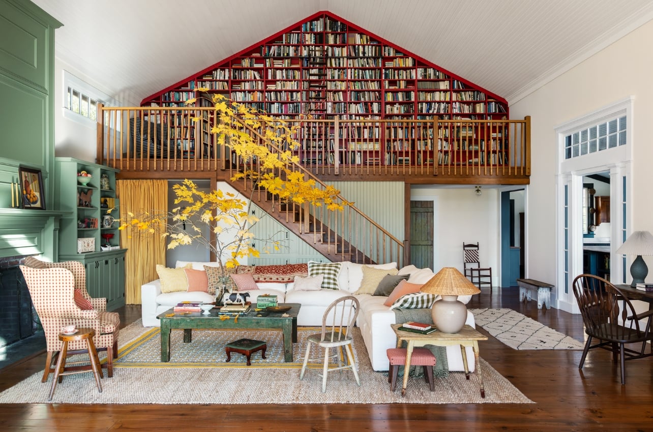 An interior of a living room with a large bookcase library from the book, The Happy Home