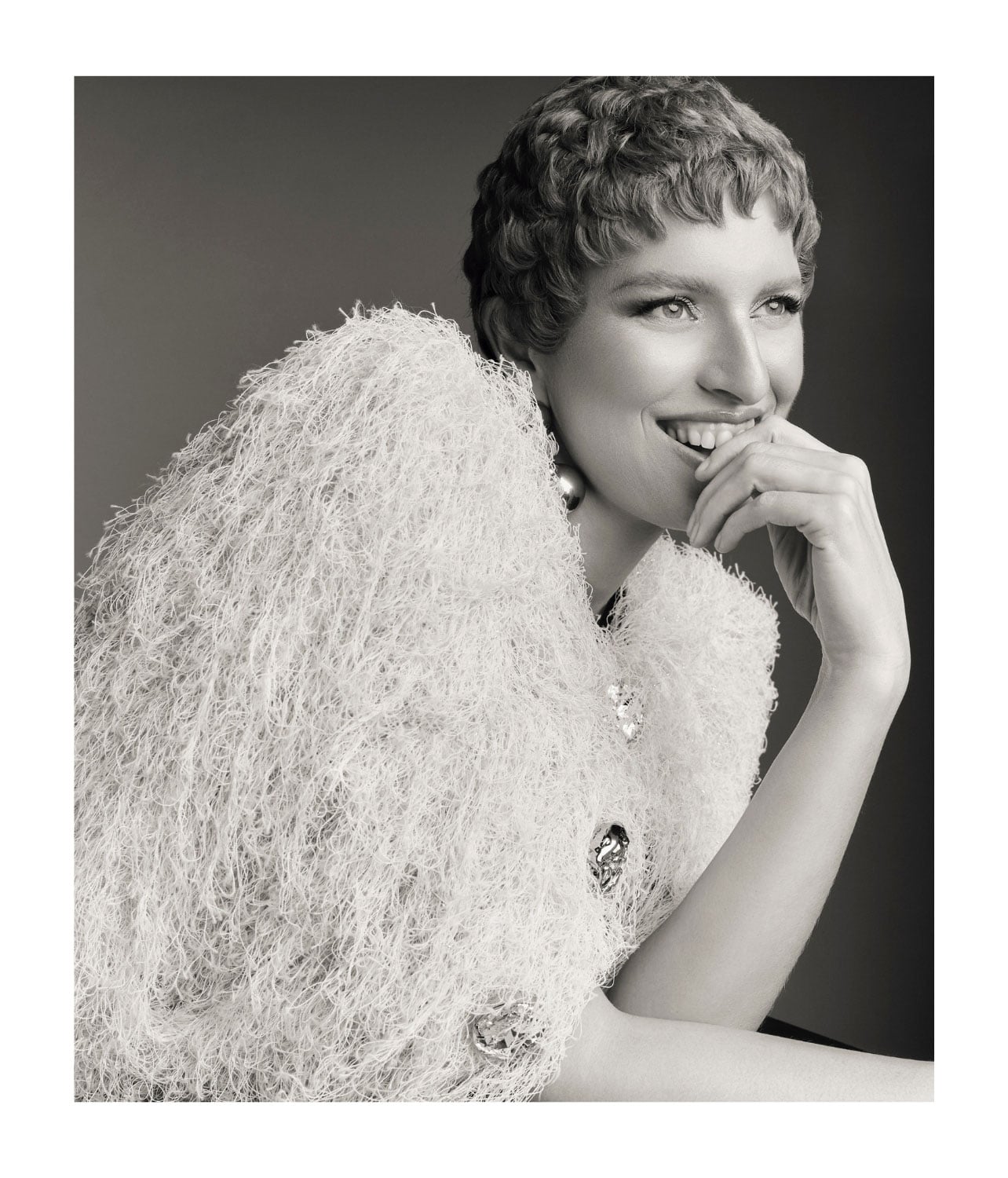 Portrait of a model wearing a white fuzzy sweater