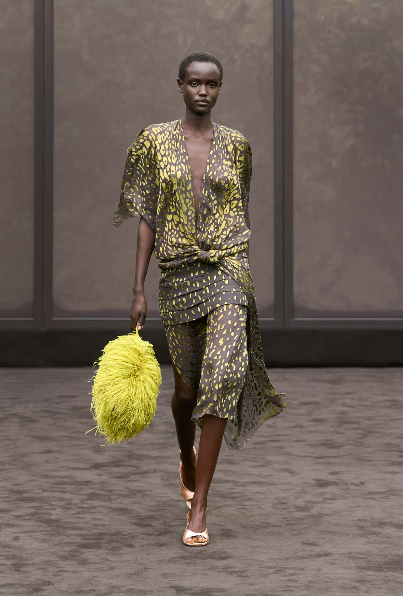 Ferragamo runway model wearing an animal print dress in brown and lime green