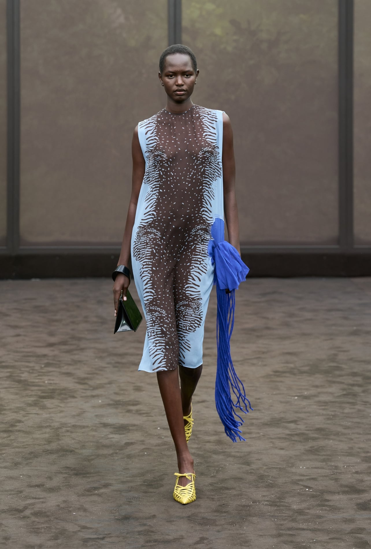 Ferragamo runway model wearing a blue and brown dress
