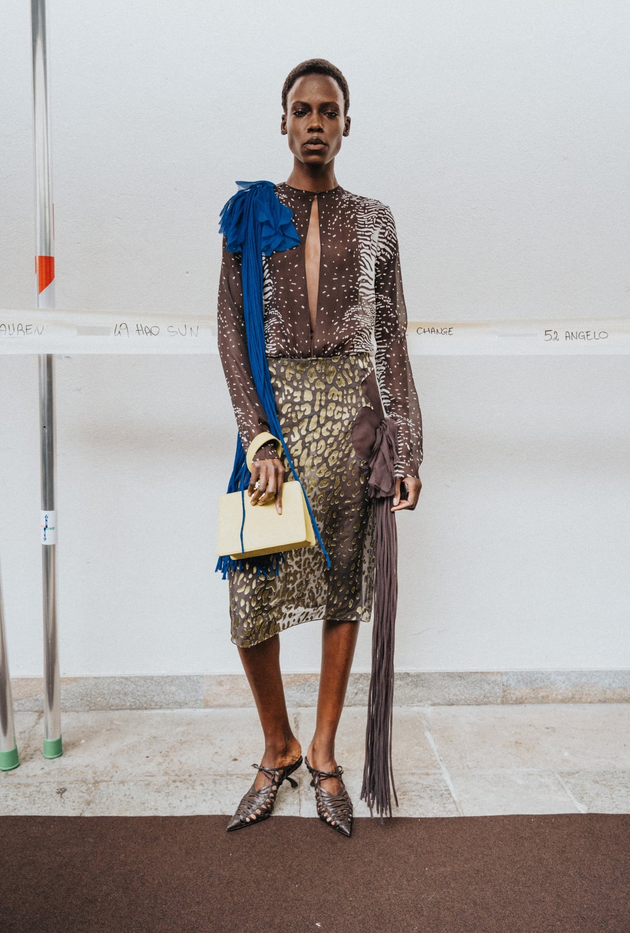 Ferragamo runway model wearing a leopard skirt and zebra dress