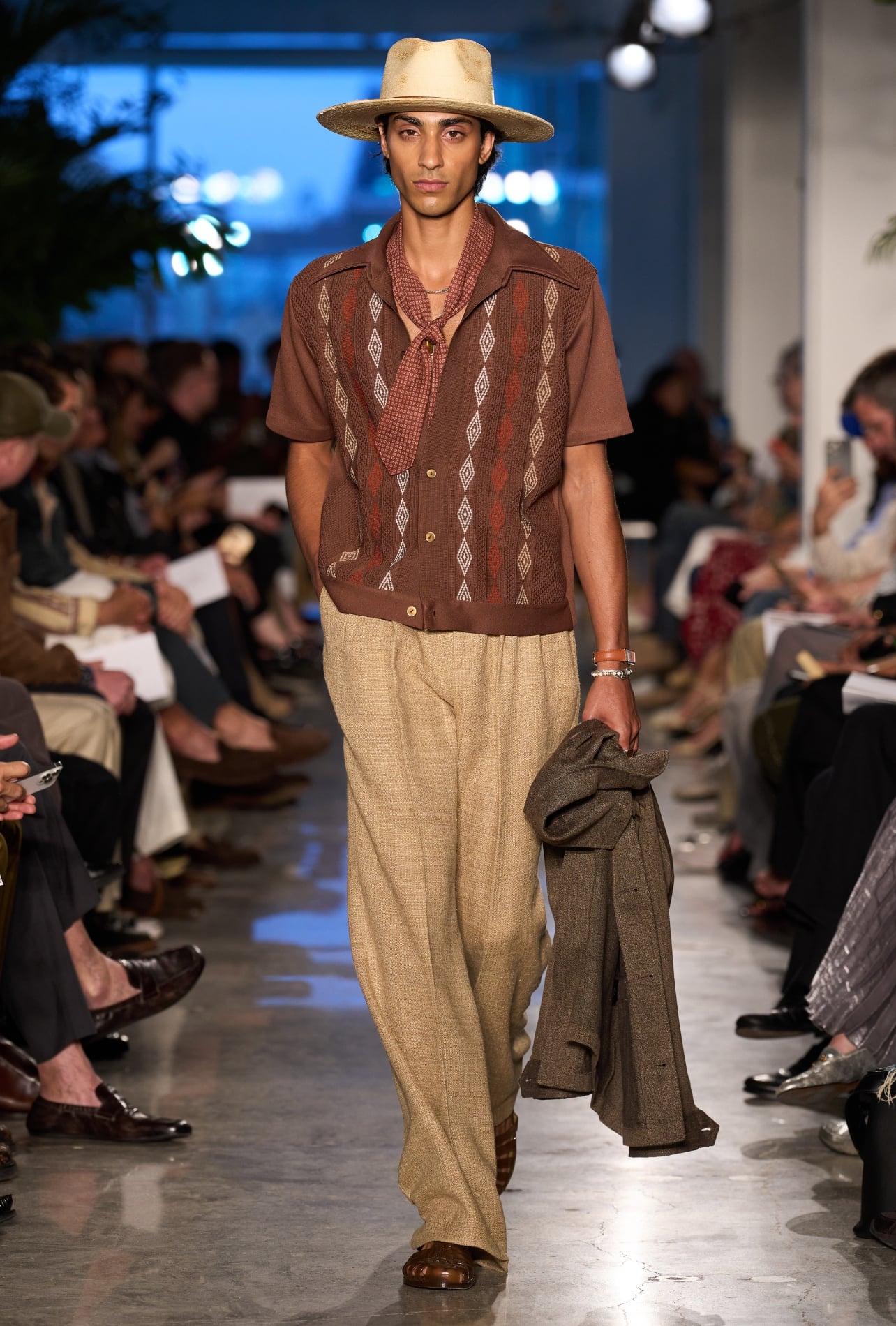 Todd Snyder runway model wearing a brown shirt and neck scarf