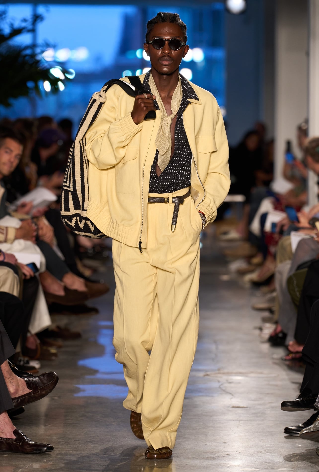 Todd Snyder runway model wearing a butter yellow jacket and pant set